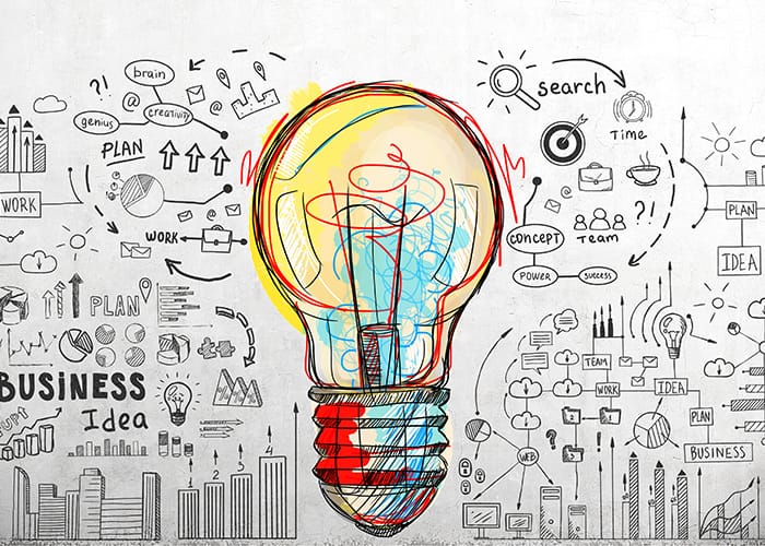 RWT_Schueler_Duales Studium_gezeichnete bunte Gluehbirne mit schwarzen Skizzen drum herum zu Business idea